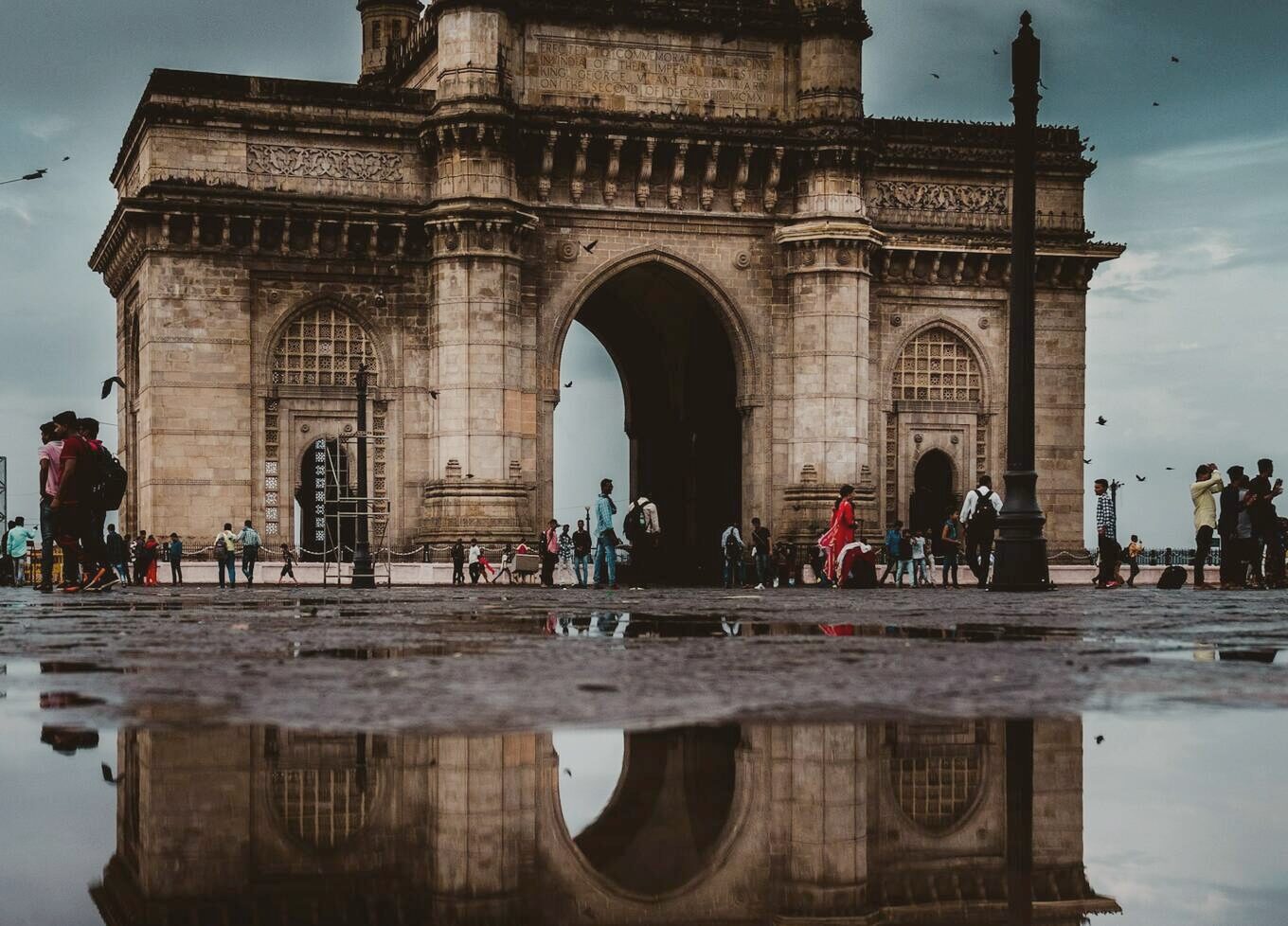 The Gateway of India reflected in rainwater after a monsoon shower